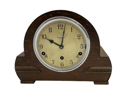 Westminster chiming mantle clock in an oak cases