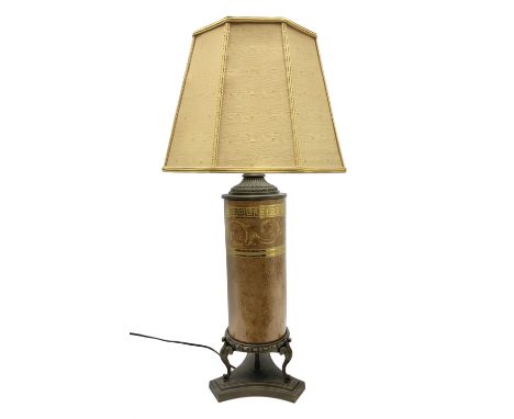 Table lamp of cylindrical form with cast metal mounts and raised upon a trefoil base with fabric shade, H75cm overall