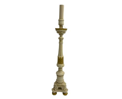 Classical design ivory and gilt painted lamp or candle stand, the reeded and turned column terminating in triform base with c