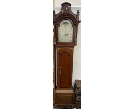 A 19th century oak and mahogany longcase clock, with an arched hood and stop fluted corinthian columns above a long arched tr