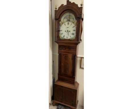 A 19th century mahogany Longcase clock the arched hood with three globe finials, and rope twist columns above a short trunk d