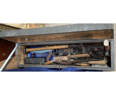 A pine chest, containing woodworking tools, including hammers, saws, planes etc 
