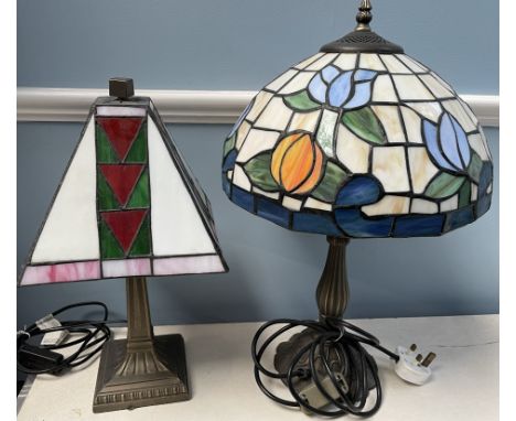 A Tiffany style table lamp, with a floral decorated shade on a baluster column together with another Tiffany style lamp