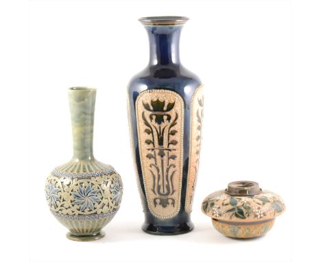 Three items of Doulton Lambeth stoneware, including a vase by Francis Lee, 1883, tapering neck, the swollen body cut with sty