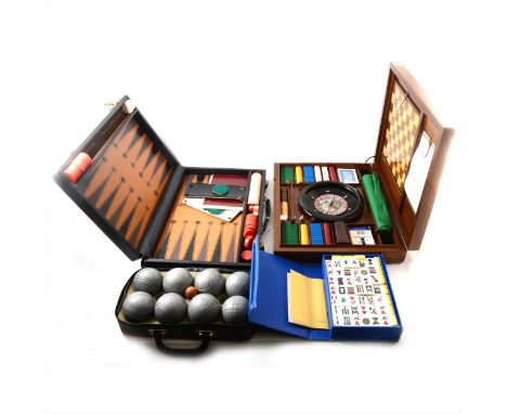 A modern Mahjong set, in a plastic case; roulette wheel; backgammon set; and a petanque set. (Qty: 4)