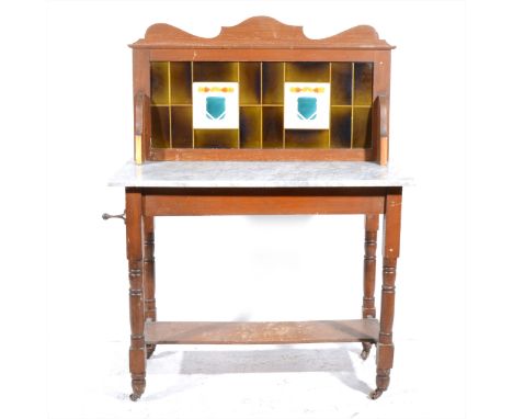 A late Victorian stained wood washstand, tiled back, marble top, turned legs, shelf under, width 91cm.