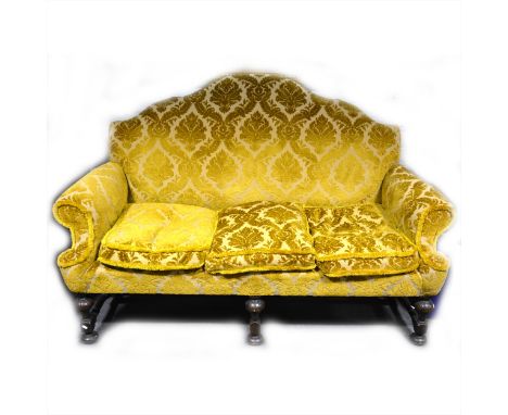 Sofa of 18th century design, upholstered in sculptured Old Gold velour, turned walnut legs, length 190cm.