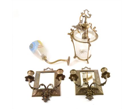 A pair of Edwardian cast brass two-light girandoles, bevelled mirror plates, 29cm; a lantern and a wall light bracket. (Qty: 