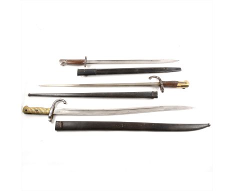 Three bayonets, one First World War British Wilkinson 1907 pattern, 58cm, two St Etienne, 1871, 71cm, and 1879, 66cm. (Qty: 3