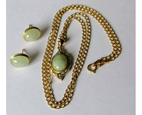 A cabochon jade and yellow gold-mounted pendant with diamond decoration on a gold chain, 44 cm, with matching earrings, hallm