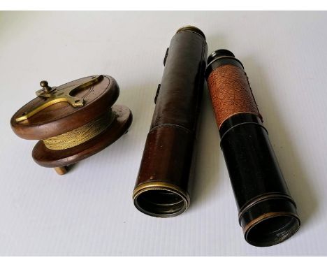 A brass and leather bound telescope by Broadhurst Clarkson &amp; Co., 63 Farringdon Road, London, 74 cm extended, one other, 