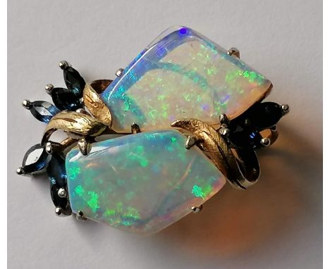 A mid-century opal and sapphire pendant on a gold setting, stamped 14k with maker's mark, 32mm x 24mm, 7.6g (each opal measur