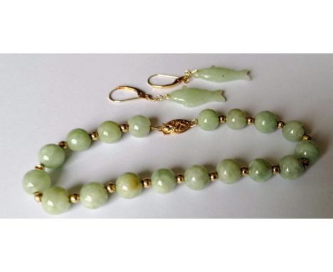 A pair of jade and gold earrings in the form of fish and a matching bead bracelet with gold clasp, stamped 14k 