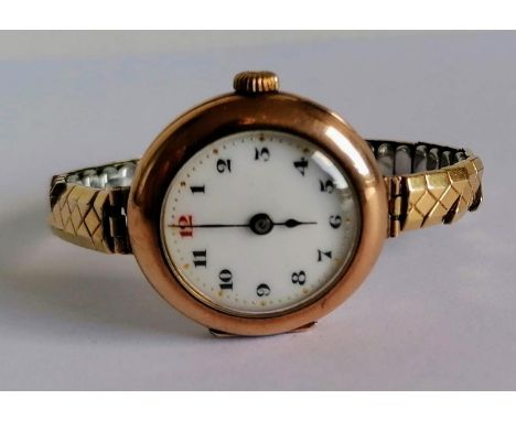 A WW1 ladies gold-cased Rolex manual wristwatch with Arabic numerals, enamel dial 25mm, hallmarked 9ct, overwound, later stra
