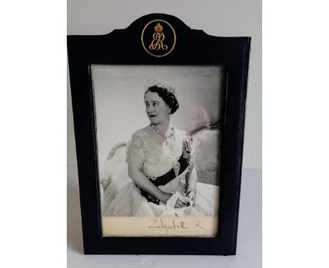 A silvered mounted photograph of the Queen Mother by Cecil Beaton, signed 'Beaton' in pencil and 'Elizabeth R 1959', studio s