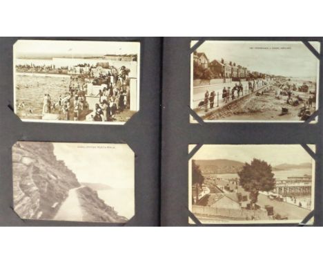 Postcards, a mixed collection of approx. 252 cards in vintage album inc. mainly printed street scenes, villages and scenic vi