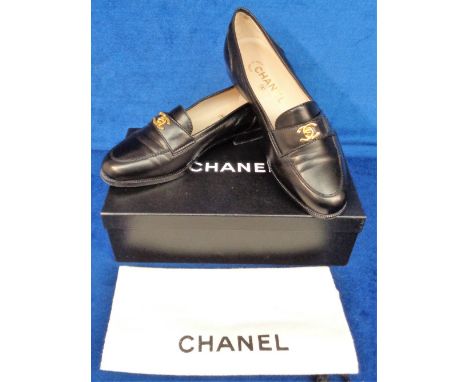 Chanel black leather loafers size 37.5 with protective shoe bag and box. Some very light wear (vg)