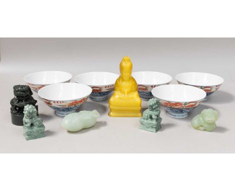 A Chinese Spinach Jade Scholars Seal, modern, surmounted by a seated dog of fo, blank matrix, 8cm high, a celadon jade model 