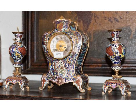 A French Champleve Enamel Striking Mantle clock Garniture, circa 1900, twin barrel movement striking on a gong, movement back