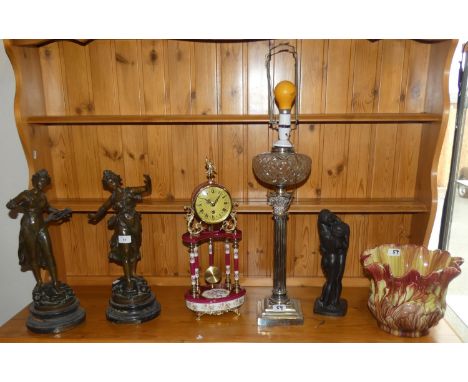 A pair of spelter figurines 'Musique &amp; Melodie' on wooden plinths, together with a mantel clock, jardiniere, table lamp a