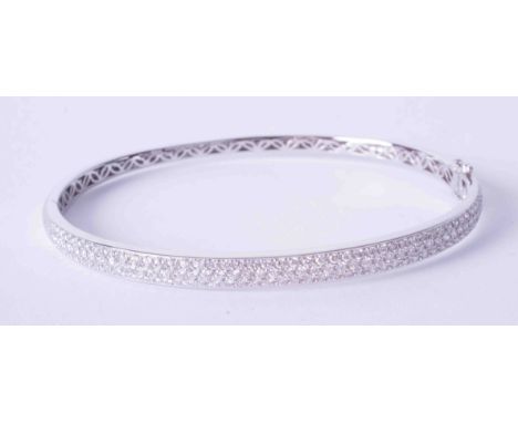 A fine 18ct white gold pave set diamond bangle, approximately 19.3g.