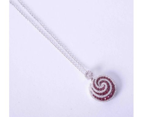 An 18ct white gold ruby &amp; diamond swirl pendant on a fine chain.