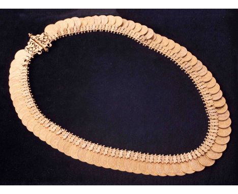 The R.B. Chetty Indian antique gold necklace, set with 72 coins, comprising Victorian half sovereigns, 43 x 1892, 7 x 1890, 6