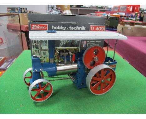 A Wilesco D40 Live Steam "Old Smoky" Tractor, very good, light steamed condition, with burner and accessories, blue/red/brigh