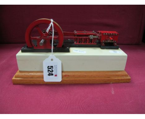 A Horizontal Steam Engine, 3 inch flywheel, single cylinder with 2cm stroke, mounted on wooden base 4.5 x 9 inch, very good.