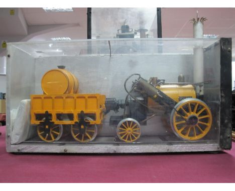 A Hornby 3½ Inch Gauge Live Steam "Stephenson's Rocket" Steam Engine and Tender, contained in a 18 x 9 x 6 inch display case.