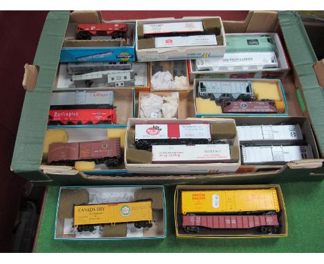 Twenty Four Items of 'HO' Gauge U.S.A Outline Rolling Stock, box vans, hopper, log carrier etc; all contained in associated b