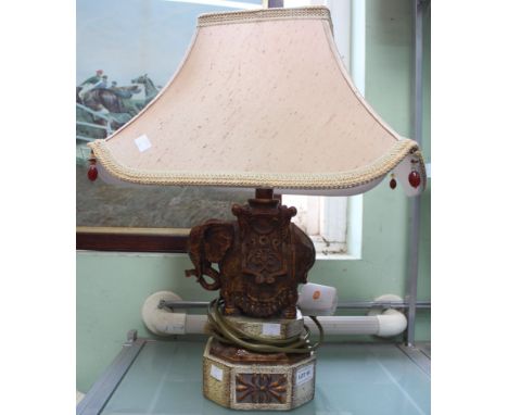 A modern table lamp in the form of an elephant with Oriental style shade