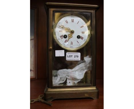 A possibly French brass four pane mantel clock