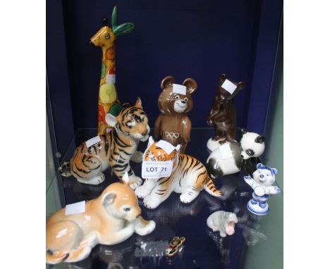 A shelf containing selection of USSR ceramic figures including Olympic Bear etc (9)