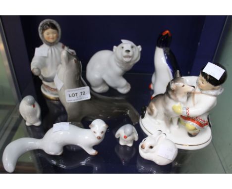 A shelf containing a selection of USSR ceramic figures to include artic figures (9)