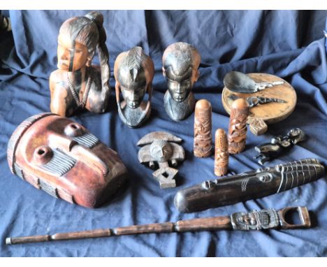 Ethnographica Interest: A collection of African tribal figures and others, to include; three carved ebony busts of Masai peop