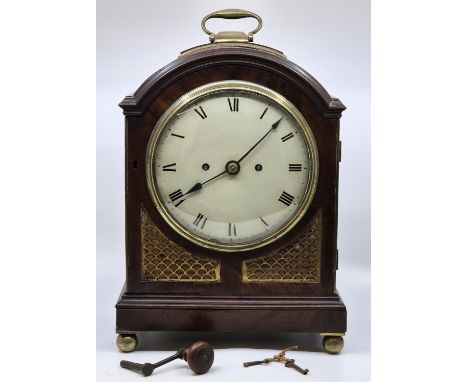 An Regency period emahogany and gilt brass mounted mantle clock, gong strike, having white enamel Roman numeral dial, the cas