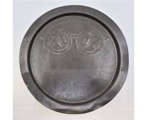 An Archibald Knox for Tudric pewter plate, made for Liberty &amp; Co, impressed mark, numbered 0163, diameter 25.3cm, togethe
