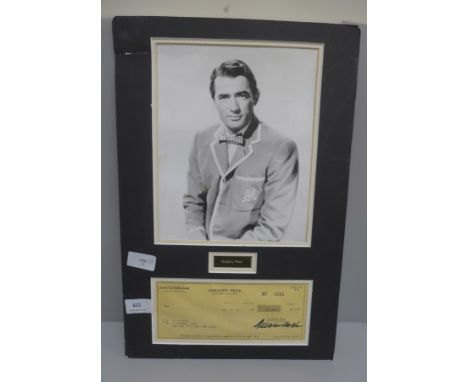 A Gregory Peck autographed cheque and photograph display 