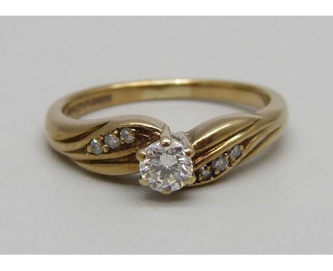 A 9ct gold and diamond ring with diamond shoulders, 2.7g, M 