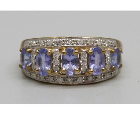 A 9ct gold, diamond and tanzanite cluster ring, 2.7g, M 