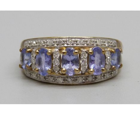 A 9ct gold, diamond and tanzanite cluster ring, 2.7g, M 