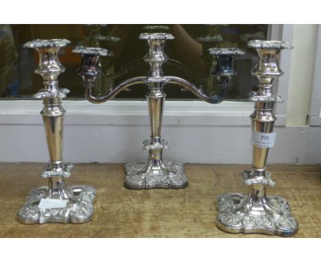 Two silver plated candlestick holders and a candelabra 