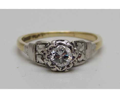 An 18ct gold, platinum and diamond solitaire ring, 2.2g, L 