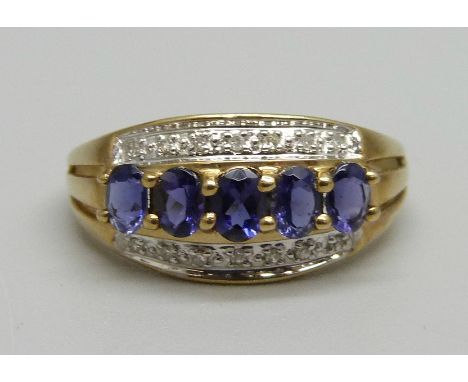 A 9ct gold, fourteen stone diamond and tanzanite ring, 2.4g, P 