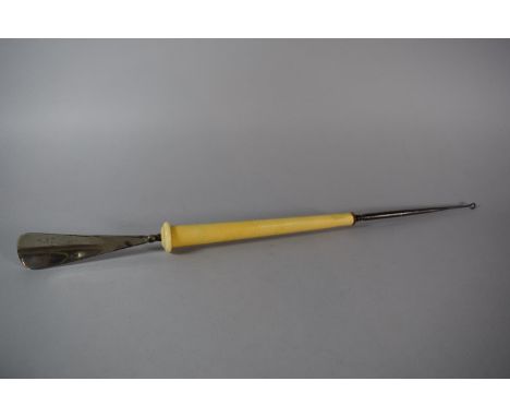 A Late 19th/Early 20th Century Ivory Handled Combination Shoe Horn and Button Hook, 54cms Long, with Amber Mount 
