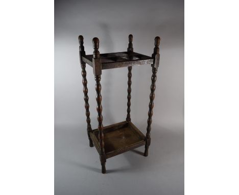 An Oak Four Division Stick Stand with Turned Bobbin Supports, 67cms High 