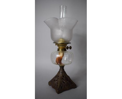 A Late Victorian Oil Lamp with Pierced Cast Iron Base Complete with Chimney and Shade Decorated with Flowers and Butterflies,