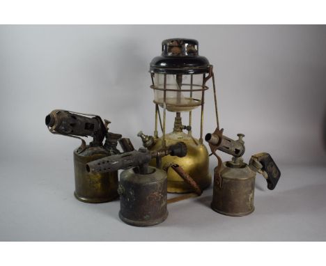 A Vintage Hurricane Lamp and Three Blow Torches 