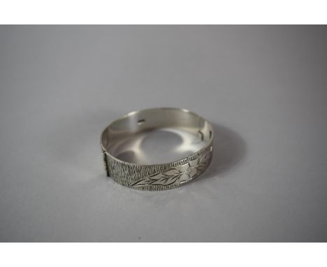 A Silver Bangle with Engraved Leaf Decoration, 33.3gms, B'Ham 1973 
